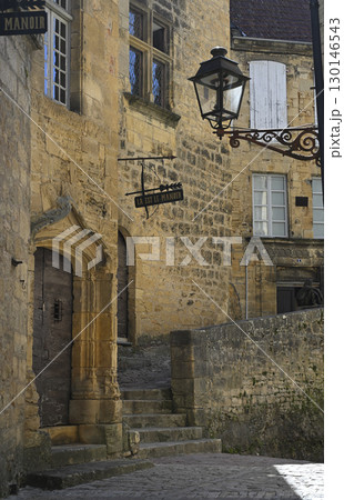 Exploring the historic charm of Sarlat in Dordogne, France with ancient stone architecture and a 130146543
