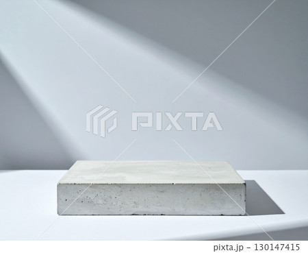 Minimalist Concrete Block Platform Against White Backdrop with a Soft Shadows 130147415