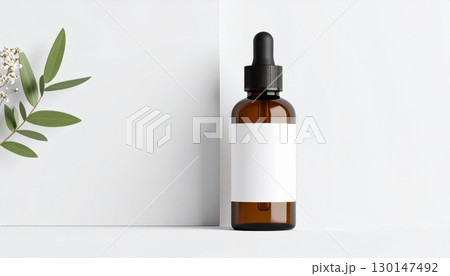 Amber Bottle with Blank Label Featuring Cosmetic Serum and Minimalist Plant Decor Amber Bottle with Blank Label Featuring Cosmetic Serum and Minimalist Plant Decor 130147492