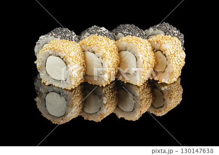 Japanese sushi rolls with sesame seeds and cream cheese on black background Japanese sushi rolls with sesame seeds and cream cheese on black background 130147638