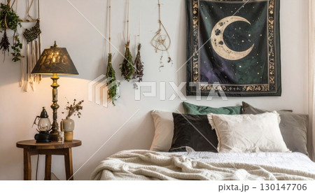 Warm Bedroom with Textured Bedding Moon Themed Wall Hanging and Antique Lamp on Wooden Table Warm Bedroom with Textured Bedding Moon Themed Wall Hanging and Antique Lamp on Wooden Table 130147706