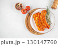 Marinated pork belly slices with spices and herbs on white plate. top view. copy space 130147760