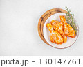 Raw marinated chicken drumsticks with spices and herbs on white plate. top view. copy space 130147761