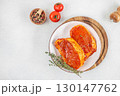 Raw marinated pork steaks with spices and herbs on white plate. top view. copy space 130147762