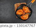 Grilled pork chops with herbs on a black grill pan. top view. copy space 130147767
