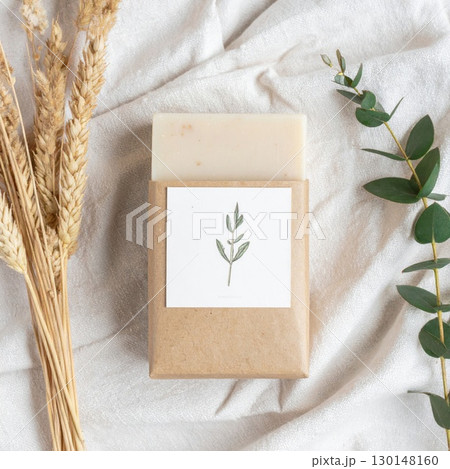 Handmade Soap Bar on Linen Fabric with Wheat Stalks and Eucalyptus Sprigs Minimalist Still Life 130148160