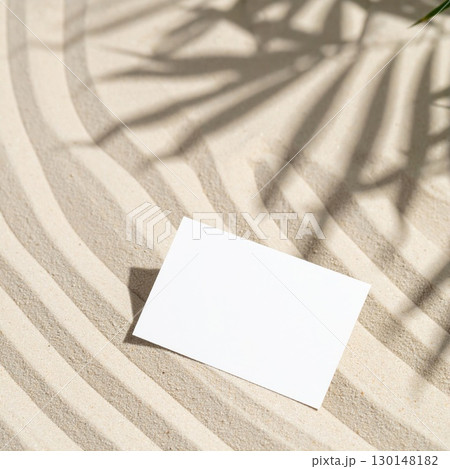 White Card on Sand with Palm Leaf Shadows a Tropical Beach Setting Natural Light 130148182