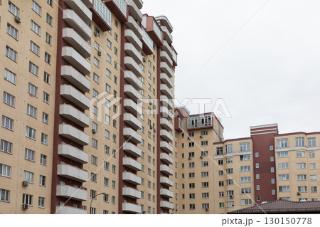 High-rise apartment buildings in a residential area showcasing properties available for rent and 130150778