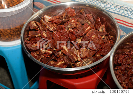 Dried Tomatoes on Display at a Local Market During Evening Hours 130150795