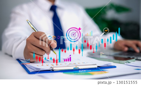 Businessman analyzing financial data with growth chart, stock market graph, and target symbol for investment strategy and business success concept 130151555