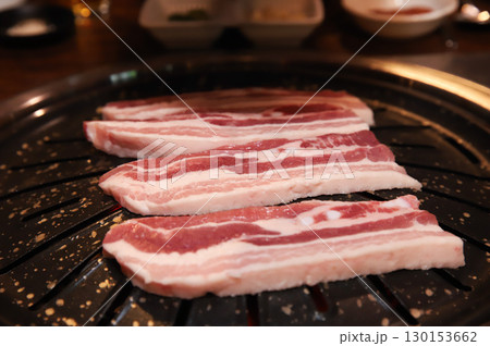 Korean BBQ. Charcoal grilled pork belly Korean BBQ. Charcoal grilled pork belly 130153662