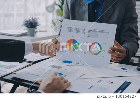 Accounting company provide finance and taxation planning for profitable cash flow, Auditor and accountant team working in office, analyze financial data and accounting record with calculator.Insight 130154227