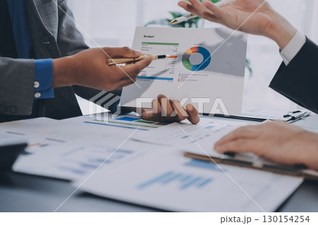 Accounting company provide finance and taxation planning for profitable cash flow, Auditor and accountant team working in office, analyze financial data and accounting record with calculator.Insight 130154254