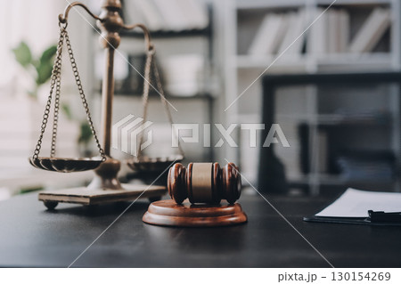 Lawyer explained to the client about the law that must be brought against the court case. Lawyer explained to the client about the law that must be brought against the court case. 130154269