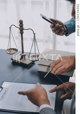 Lawyer explained to the client about the law that must be brought against the court case. Lawyer explained to the client about the law that must be brought against the court case. 130154302