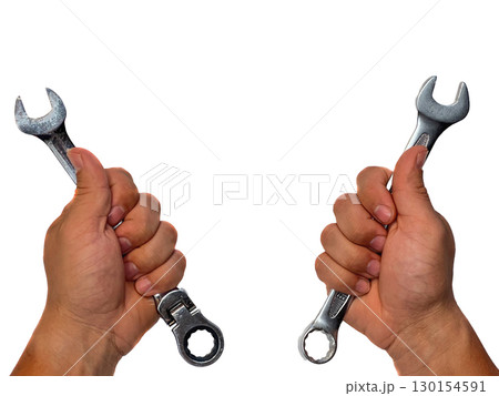 Two hands holding different types of wrenches. The left hand grips an open-end wrench Two hands holding different types of wrenches. The left hand grips an open-end wrench 130154591