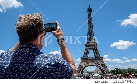 Tourist Capturing Eiffel Tower with Phone Under Sunny Parisian S Tourist Capturing Eiffel Tower with Phone Under Sunny Parisian S 130154840