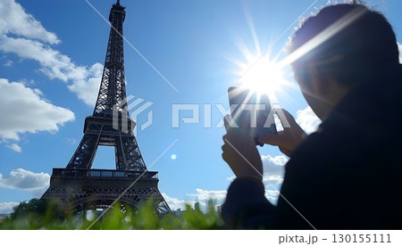 Eiffel Tower Captured by Phone Under Bright Sun in Paris 130155111