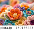 Colorful Handcrafted Yarn Flowers in Vibrant Artistic Composition 130156223
