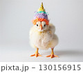 Adorable Yellow Chick Wearing Knitted Hat Posing Against White Background 130156915