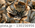 Metallic Flower Sculpture Representing Futuristic Technology and Innovation 130156956