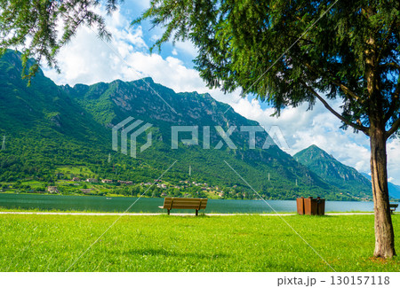 Crone public park with empty benches on Lake Idro, Lombardy, Italy. 130157118