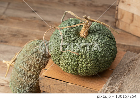 Buen Gusto de Horno Heirloom Pumpkins on Wooden Crate Buen Gusto de Horno Heirloom Pumpkins on Wooden Crate 130157254