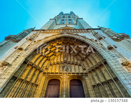 The glorious front door of Ghent cathedral highlighted in golden light 130157388