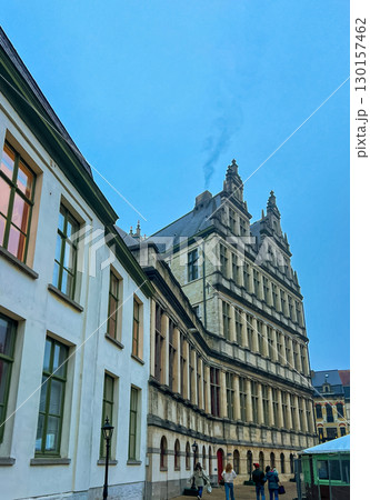 Historic town hall of Ghent: stunning stone facade against blue sky 130157462