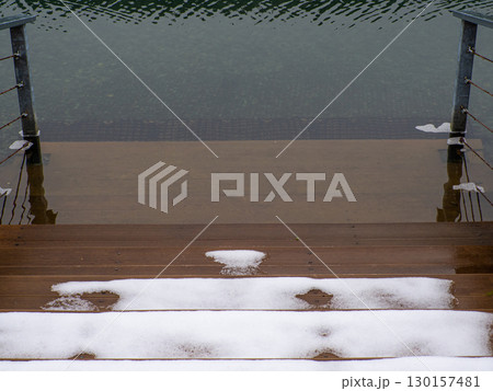 Snowy wooden Steps Leading to lake Snowy wooden Steps Leading to lake 130157481