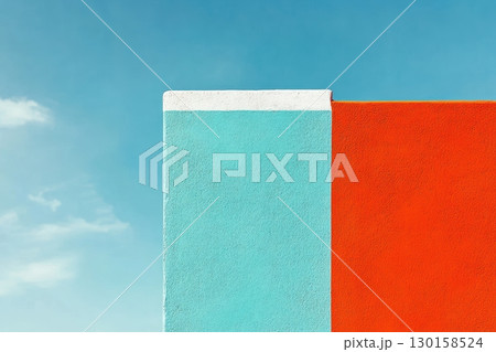 Brightly colored walls contrasting against a clear blue sky create vibrant architectural interest Brightly colored walls contrasting against a clear blue sky create vibrant architectural interest 130158524