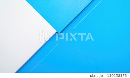 Bright blue and white paper sheets layered at an angle creating a modern composition Bright blue and white paper sheets layered at an angle creating a modern composition 130158576