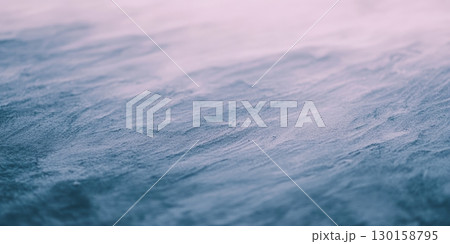 Rippling waves shimmer under soft light at dawn by the calm shore Rippling waves shimmer under soft light at dawn by the calm shore 130158795