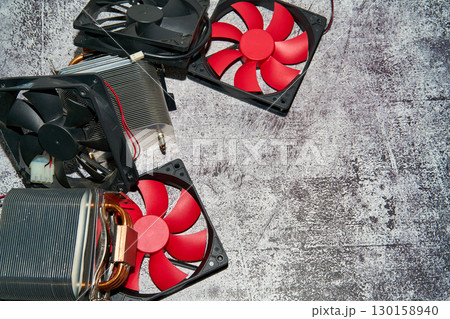 From above of vintage red CPU cooler also called PC cooling fan placed on surface 130158940