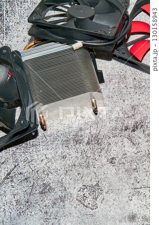 From above of vintage red CPU cooler also called PC cooling fan placed on surface From above of vintage red CPU cooler also called PC cooling fan placed on surface 130158943