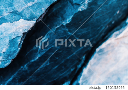 Beautiful blue rock formations displaying unique texture and color variations in natural setting 130158963