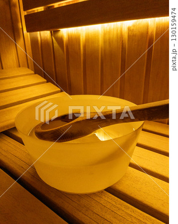 Relaxing Wooden Sauna Interior, Wooden sauna interior with pebbles in a wooden box Relaxing Wooden Sauna Interior, Wooden sauna interior with pebbles in a wooden box 130159474