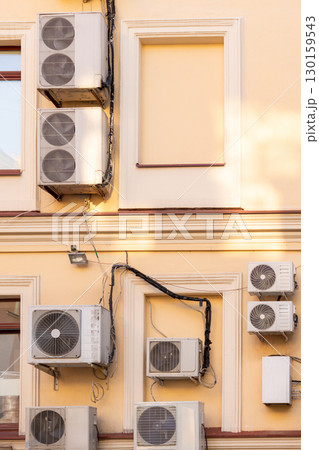 air conditioners are installed on the wall of the building. cooling in hot weather. 130159543