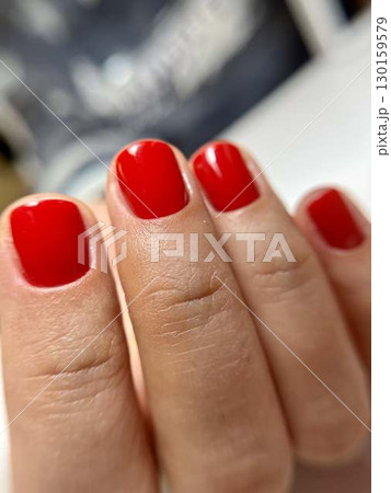Female hand with red manicure, nail design, christmas manicure Female hand with red manicure, nail design, christmas manicure 130159579
