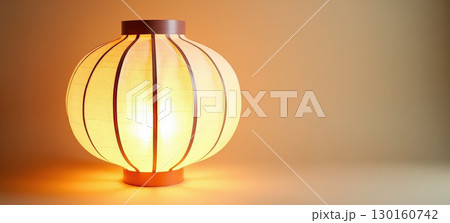 Glowing paper lantern illuminating room 130160742