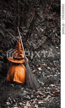 Halloween decoration with witch hat and broomstick 130160802