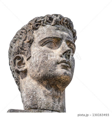 A stone statue of man head with detailed features and contemplative expression, showcasing ancient craftsmanship. sculpture highlights texture and artistry of historical stonework 130163493