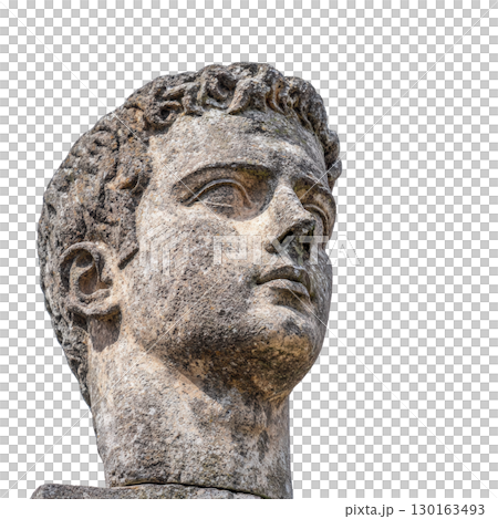 A stone statue of man head with detailed features and contemplative expression, showcasing ancient craftsmanship. sculpture highlights texture and artistry of historical stonework 130163493