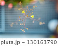 small yellow flowers on blurred gray background 130163790