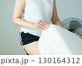 Hands woman making bed at home in the morning,Make a bed 130164312