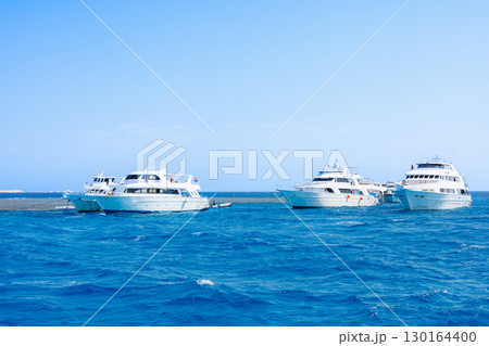 Luxury yachts anchored in Red Sea 130164400