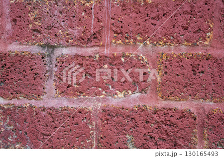 Full frame shot of laterite stone wall textured and background. Laterite stone often used in the construction of temple walls, particularly in Southeast Asia. Full frame shot of laterite stone wall textured and background. Laterite stone often used in the construction of temple walls, particularly in Southeast Asia. 130165493