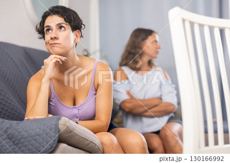 Offended girlfriends ignoring each other after quarrel Offended girlfriends ignoring each other after quarrel 130166992