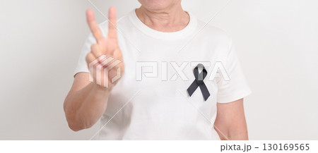 Elderly with Black ribbon for May Melanoma and skin cancer Awareness month, October Vaccine injury awareness month, Mourning Remembrance, March Sleep awareness week, Gang Prevention and Anti Violence Elderly with Black ribbon for May Melanoma and skin cancer Awareness month, October Vaccine injury awareness month, Mourning Remembrance, March Sleep awareness week, Gang Prevention and Anti Violence 130169565