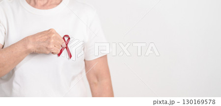 Elderly with Burgundy Ribbon for March Multiple Myeloma Cancer Awareness month, September Sickle Cell Anemia, Headache and Migraine week, April world Meningitis day, October Hospice  Palliative care 130169578